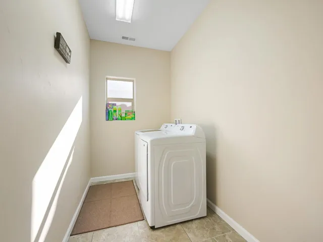 a view of a livingroom with furniture and a gym parking