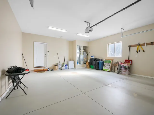 a view of a balcony with chairs and a table