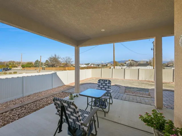 a view of a house with backyard porch and outdoor seating