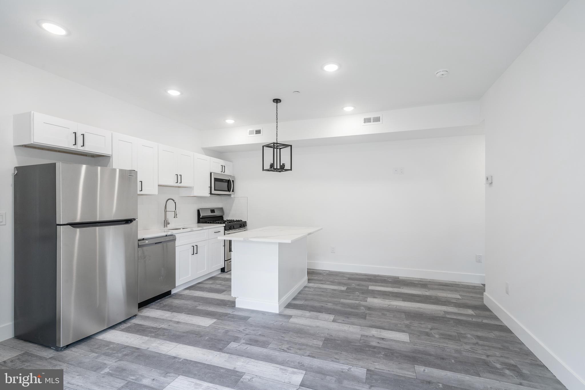 4111 Parrish Street Philadelphia, PA 19104 - Photo 17 of 38 a kitchen with refrigerator and cabinets