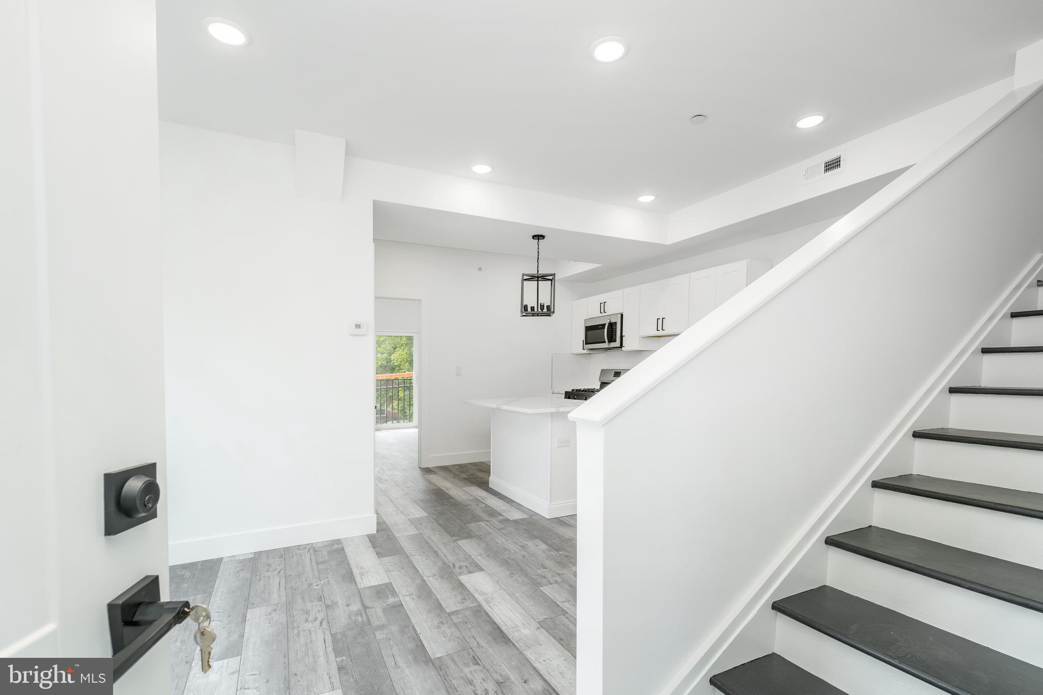 4111 Parrish Street Philadelphia, PA 19104 - Photo 25 of 38 a view of entryway with stairs and wooden floor