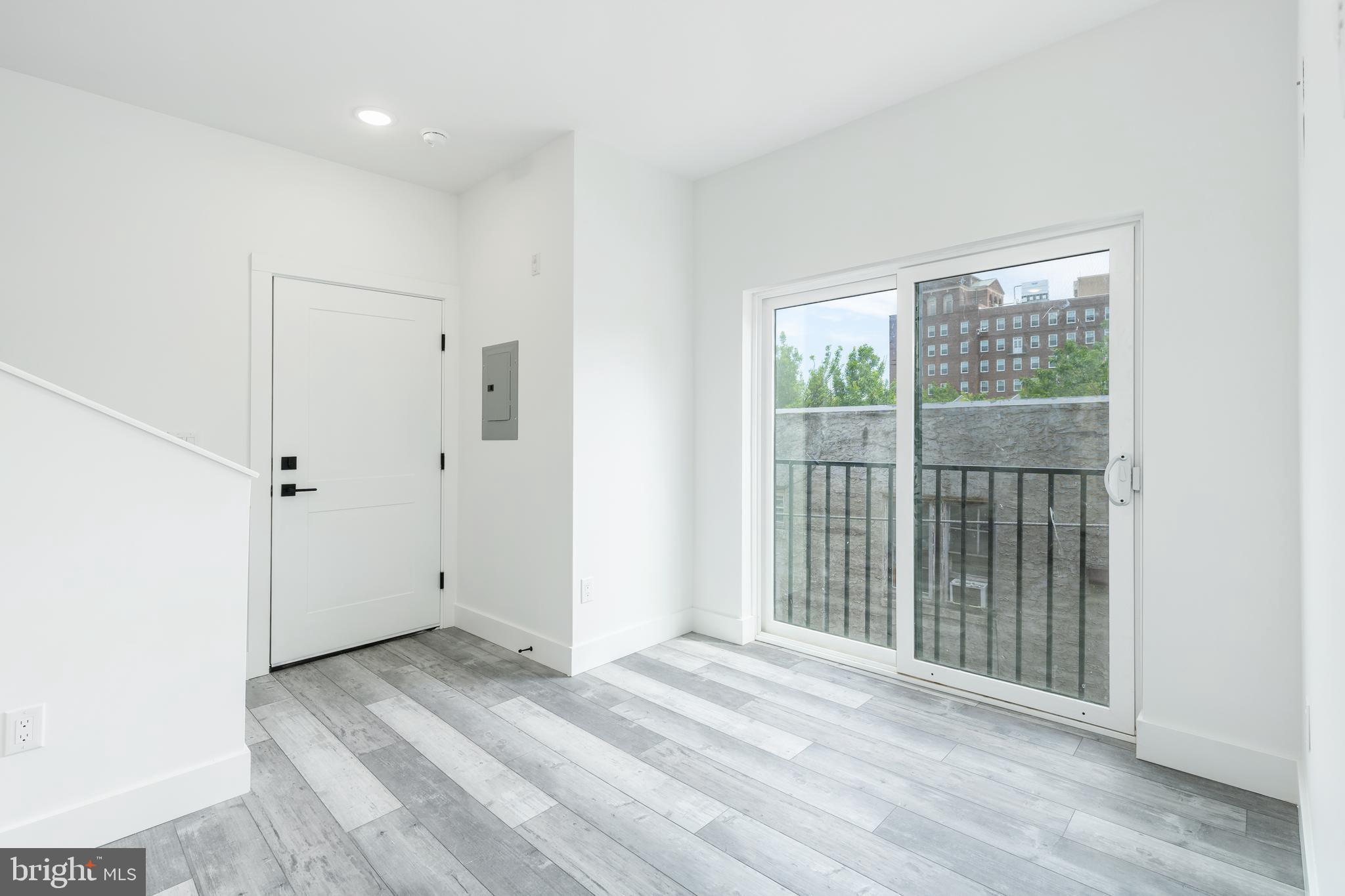 4111 Parrish Street Philadelphia, PA 19104 - Photo 29 of 38 a view of a room with wooden floor and windows