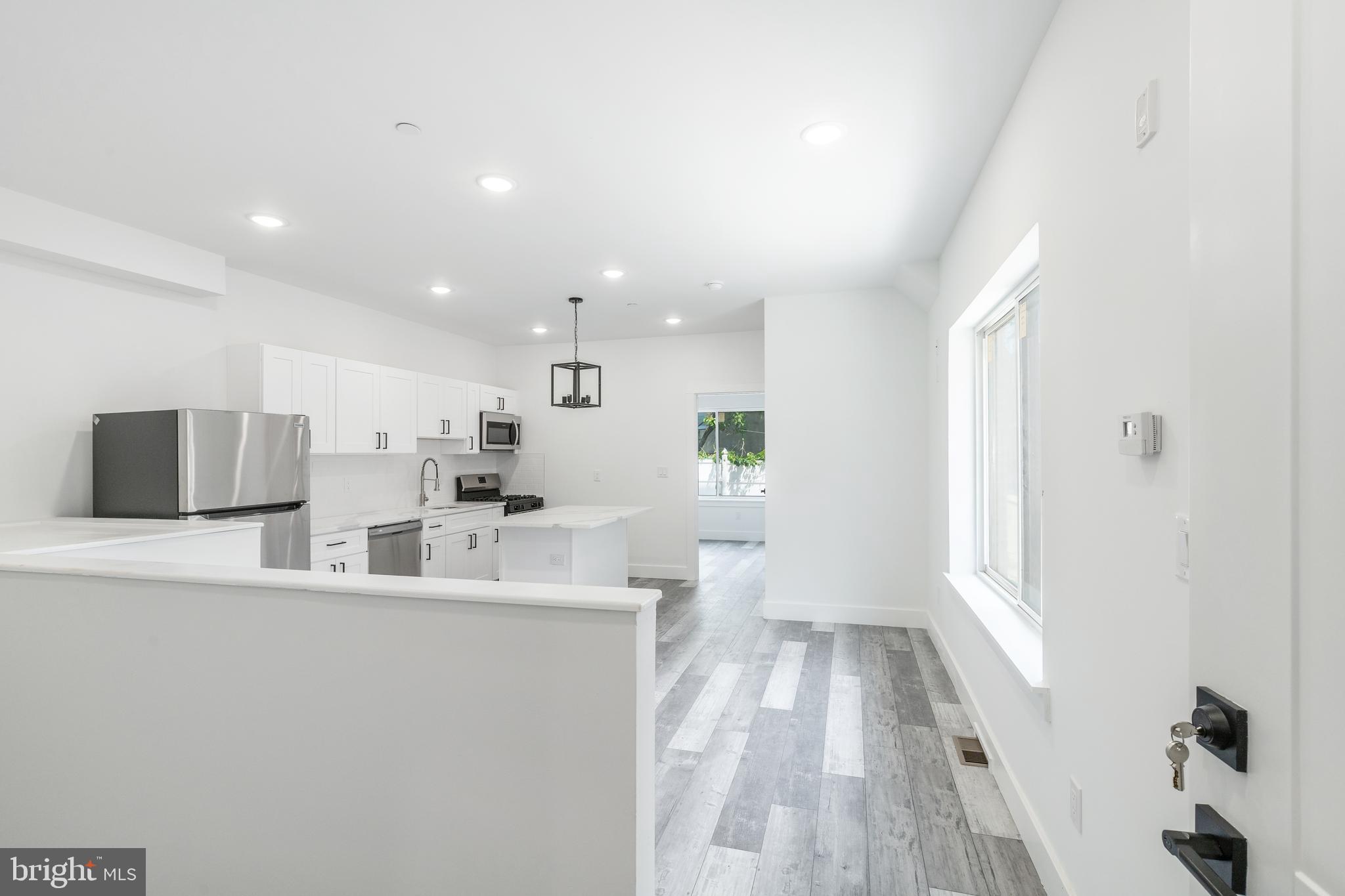 4111 Parrish Street Philadelphia, PA 19104 - Photo 3 of 38 a large white kitchen with a large window