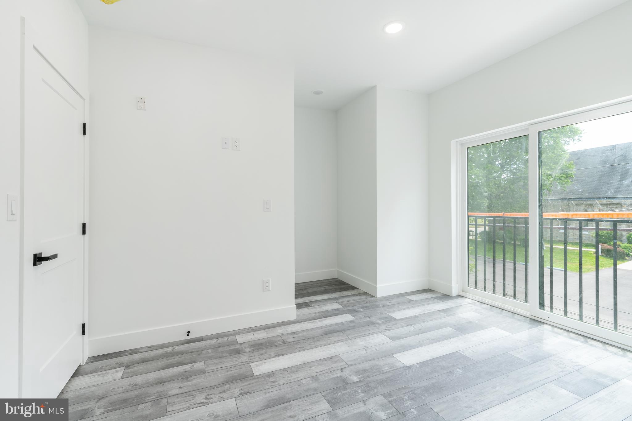 4111 Parrish Street Philadelphia, PA 19104 - Photo 32 of 38 a view of an empty room with wooden floor and a window