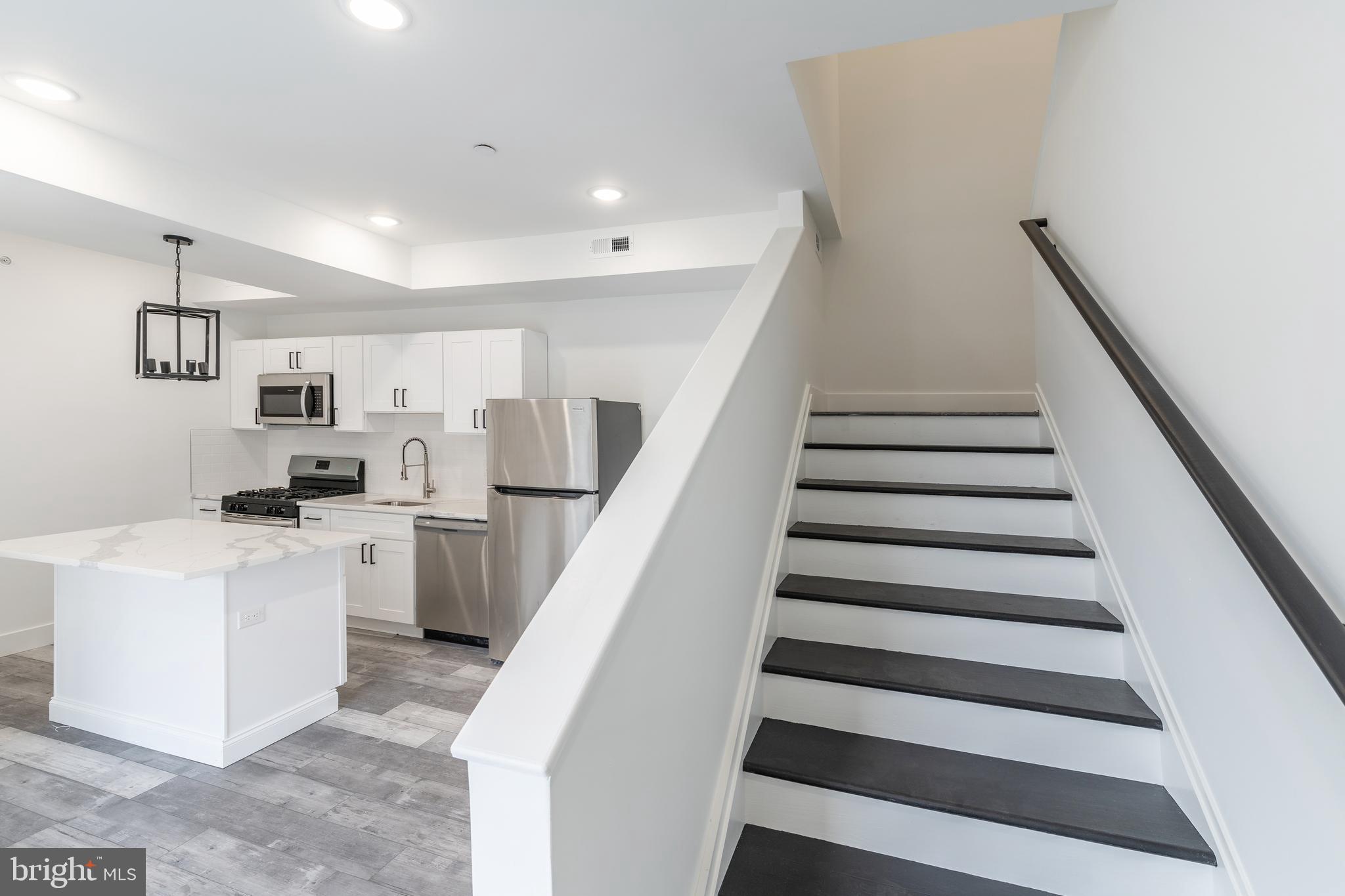 4111 Parrish Street Philadelphia, PA 19104 - Photo 34 of 38 a view of kitchen with sink microwave and stove