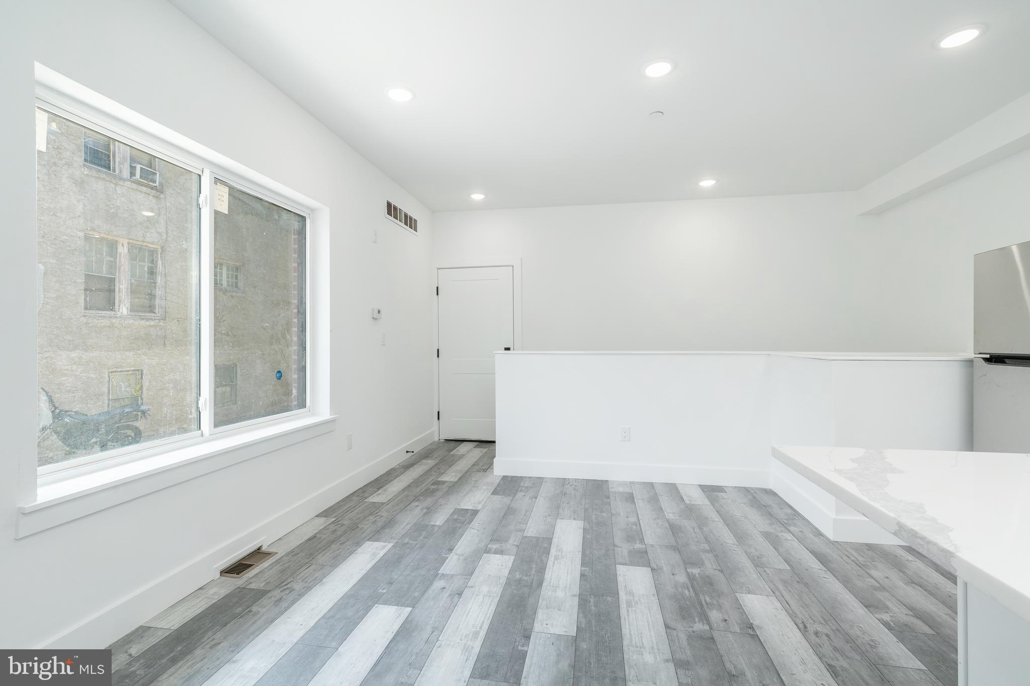 4111 Parrish Street Philadelphia, PA 19104 - Photo 8 of 38 a view of empty room with wooden floor and fan