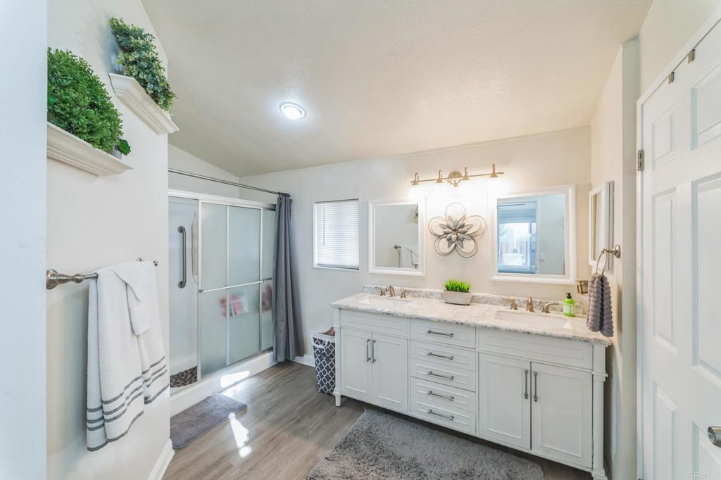 27250 Murrieta Road, Unit 364 Menifee, CA 92586 - Photo 11 of 17 a bathroom with a double vanity sink and mirror