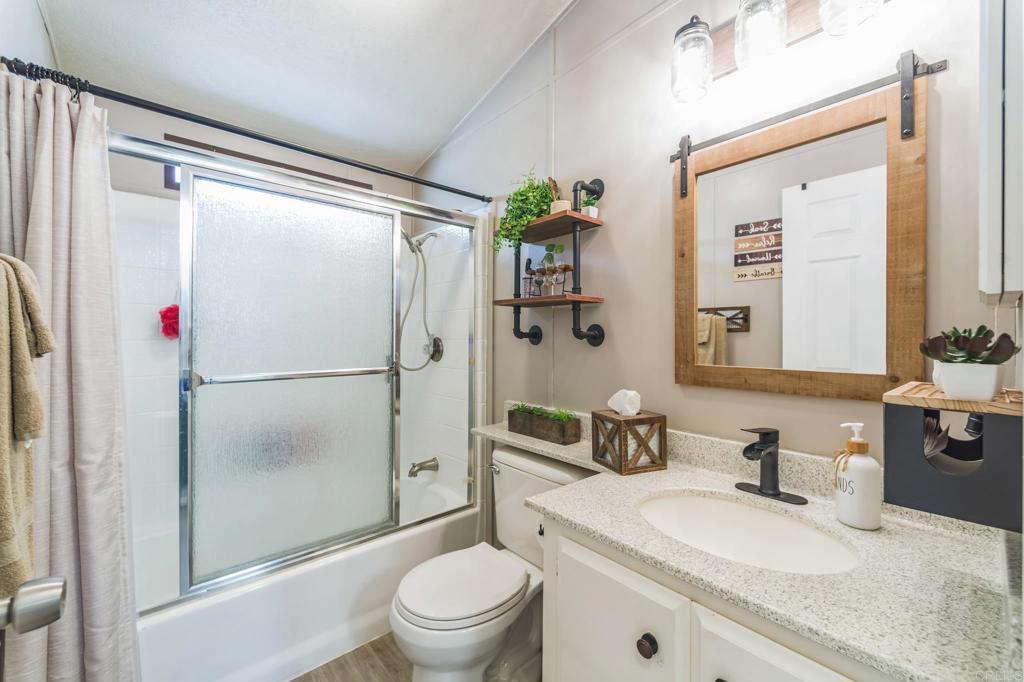 27250 Murrieta Road, Unit 364 Menifee, CA 92586 - Photo 12 of 17 a bathroom with a sink toilet and shower
