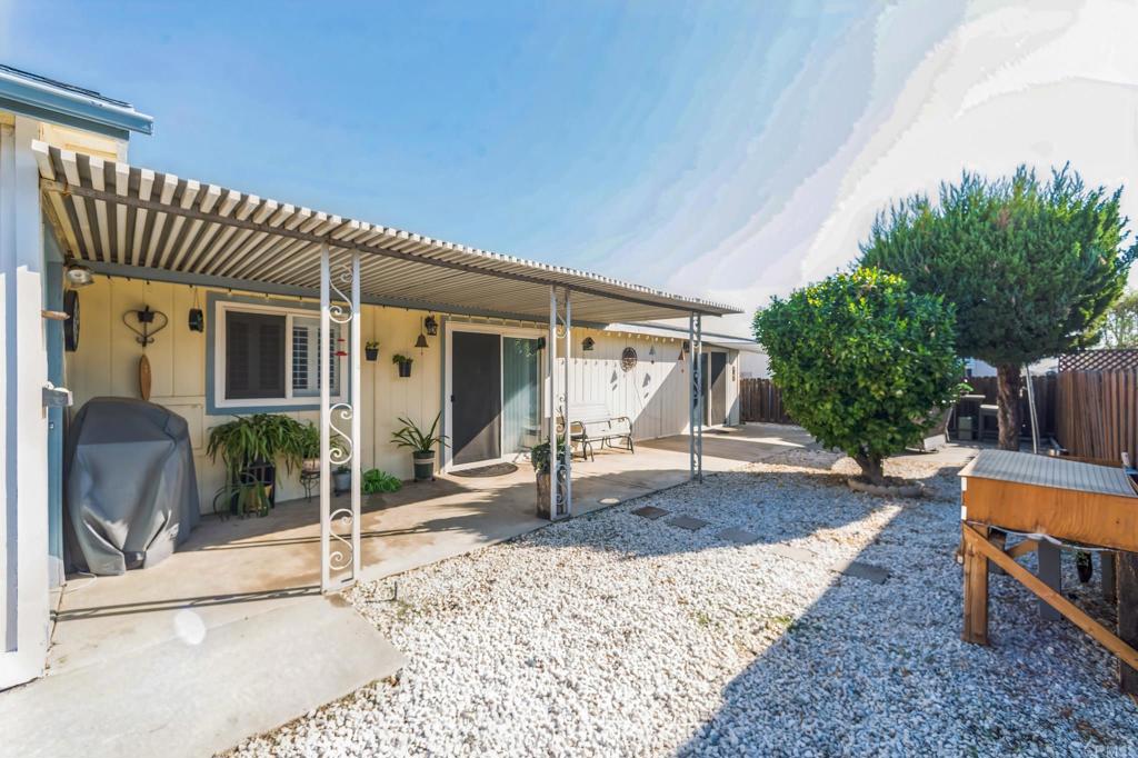 27250 Murrieta Road, Unit 364 Menifee, CA 92586 - Photo 16 of 17 a view of a house with backyard and sitting area