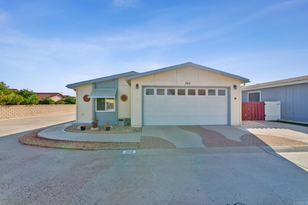 27250 Murrieta Road, Unit 364 Menifee, CA 92586 - Photo 4 of 17 a big house with a big yard and large trees