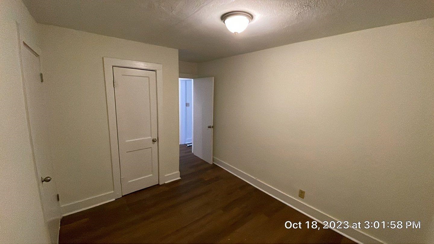 75 East Peebles Road Memphis, TN 38109 - Photo 5 of 10 an empty room with wooden floor