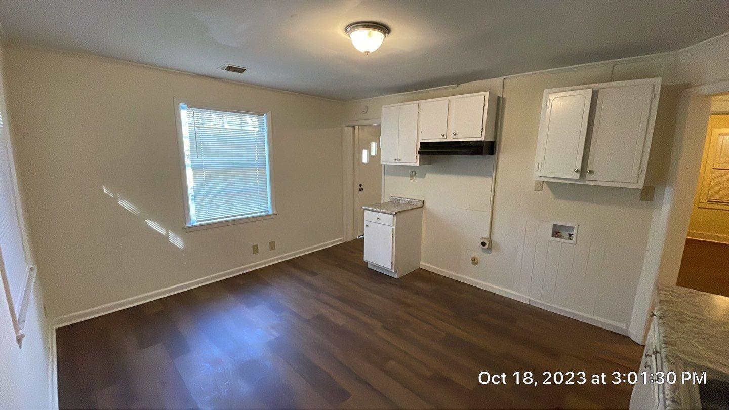 75 East Peebles Road Memphis, TN 38109 - Photo 8 of 10 a view of a kitchen with wooden floor and a window