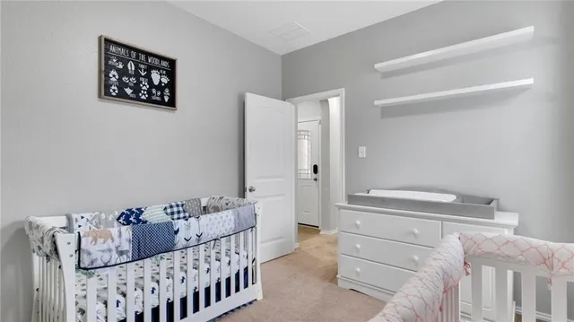 a bedroom with a bed and a couch