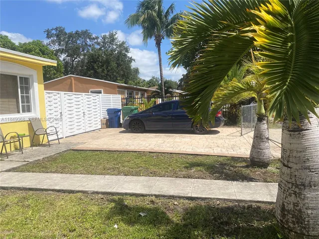 a view of a backyard of the house