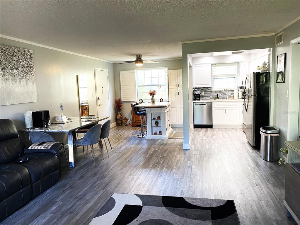 1500 Gay Road, Unit 24B Winter Park, FL 32789 - Photo 7 of 21 a living room with furniture and a large window
