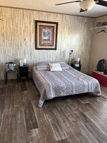 a bedroom with a bed and a table