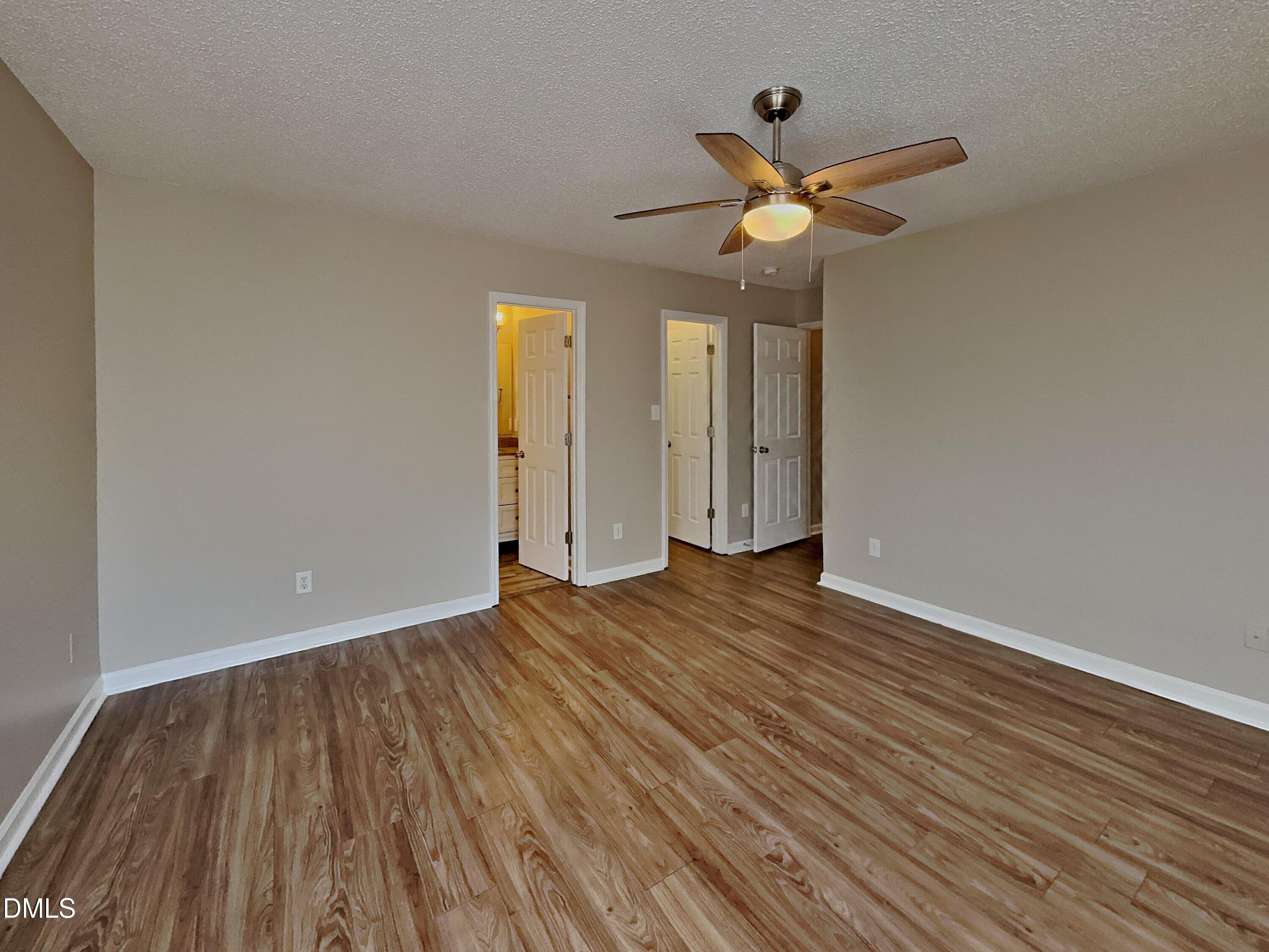 5516 Wilhagan Court Raleigh, NC 27616 - Photo 6 of 16 a view of empty room with wooden floor