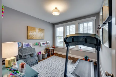 a bedroom with bed and a window