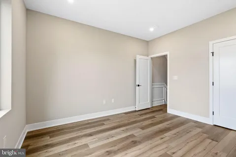 a view of room with wooden floor