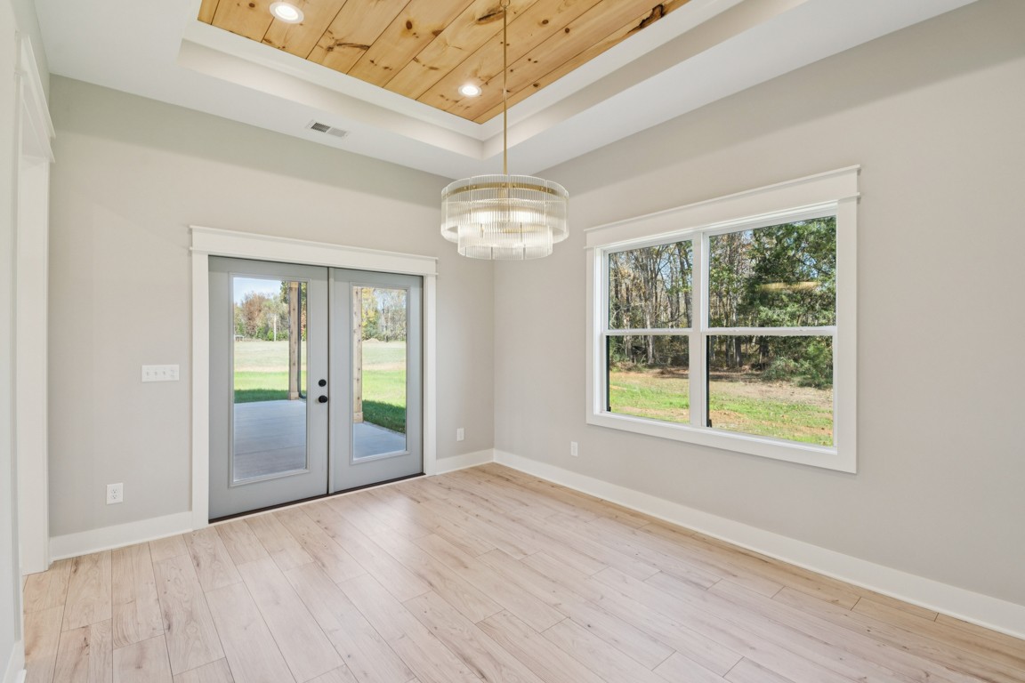 2309 Hunter Road Lewisburg, TN 37091 - Photo 11 of 27 an empty room with wooden floor and windows