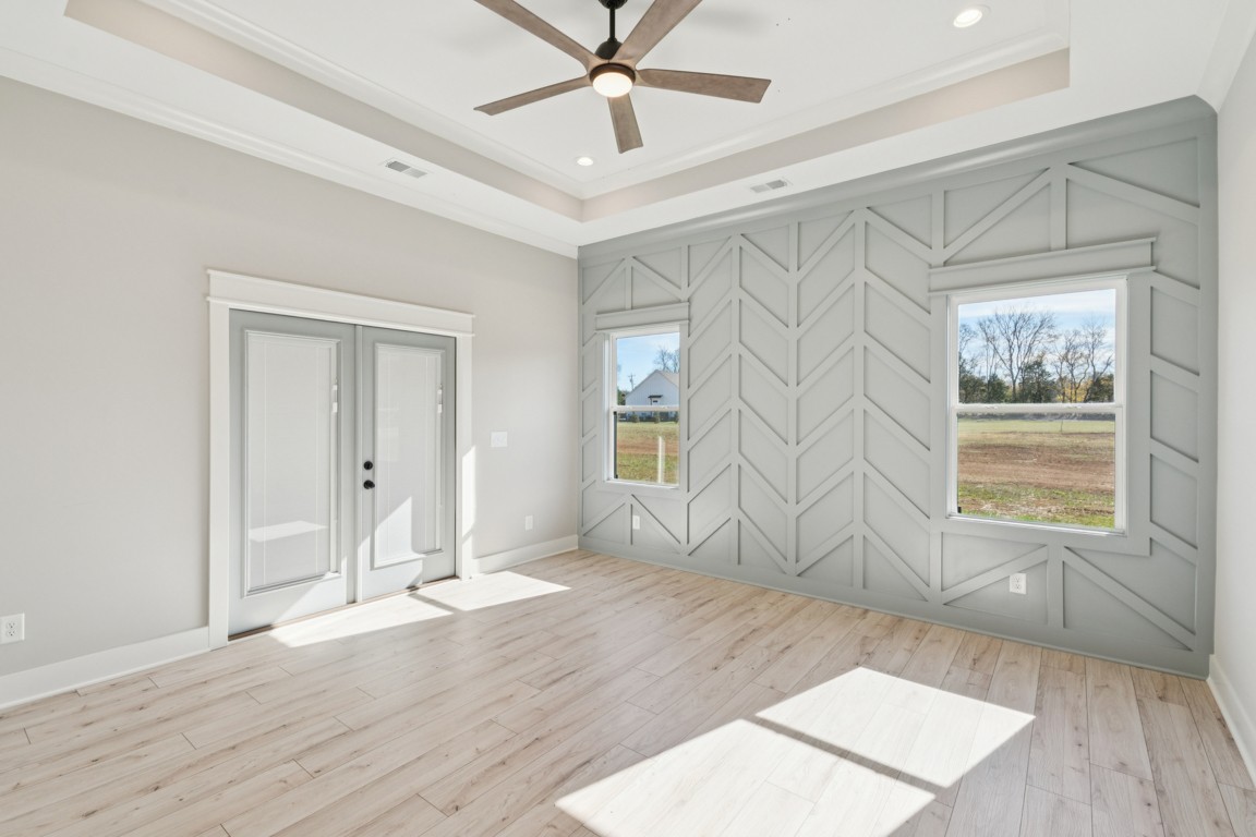 2309 Hunter Road Lewisburg, TN 37091 - Photo 12 of 27 a view of an empty room with wooden floor and a window