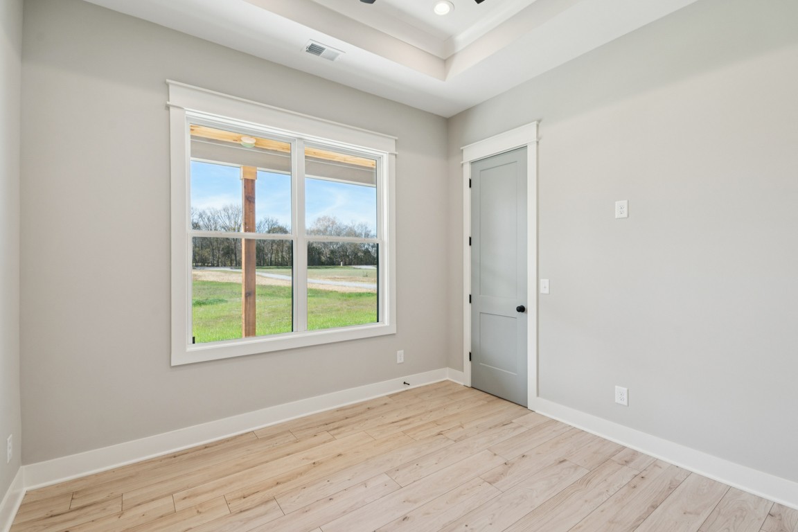 2309 Hunter Road Lewisburg, TN 37091 - Photo 17 of 27 an empty room with wooden floor and windows