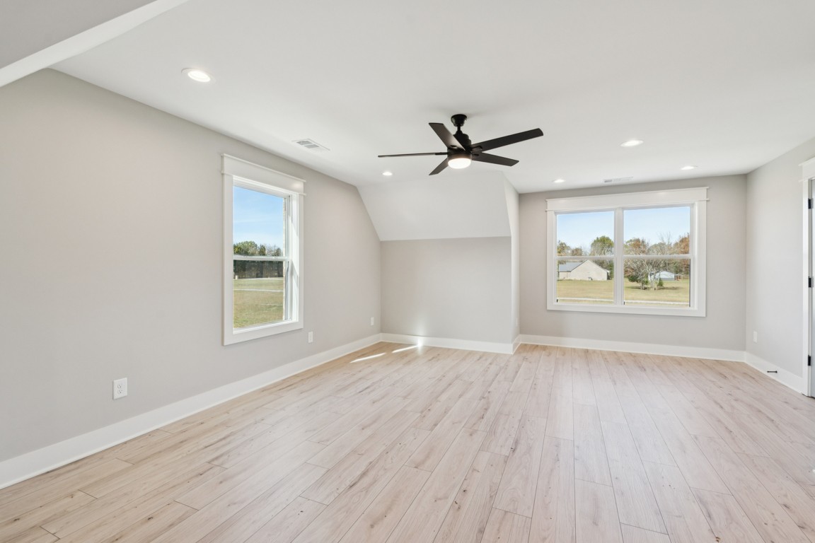 2309 Hunter Road Lewisburg, TN 37091 - Photo 18 of 27 an empty room with wooden floor and windows