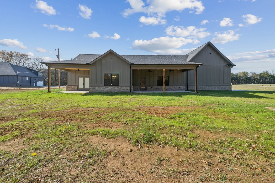 2309 Hunter Road Lewisburg, TN 37091 - Photo 24 of 27 a front view of a house with a yard and garage