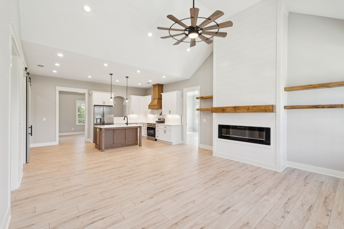 2309 Hunter Road Lewisburg, TN 37091 - Photo 6 of 27 a view of a kitchen with furniture and a fireplace