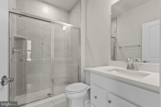 a view of a hallway with a room