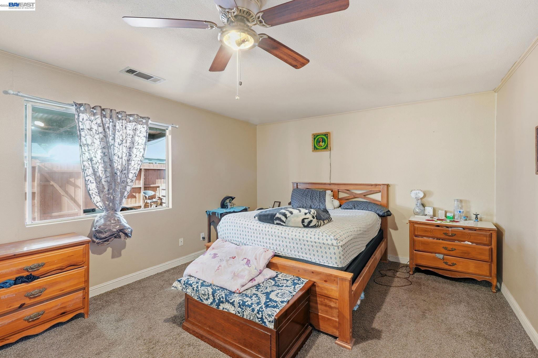 10378 South Priest Road French Camp, CA 95231 - Photo 15 of 44 a bedroom with bed and window