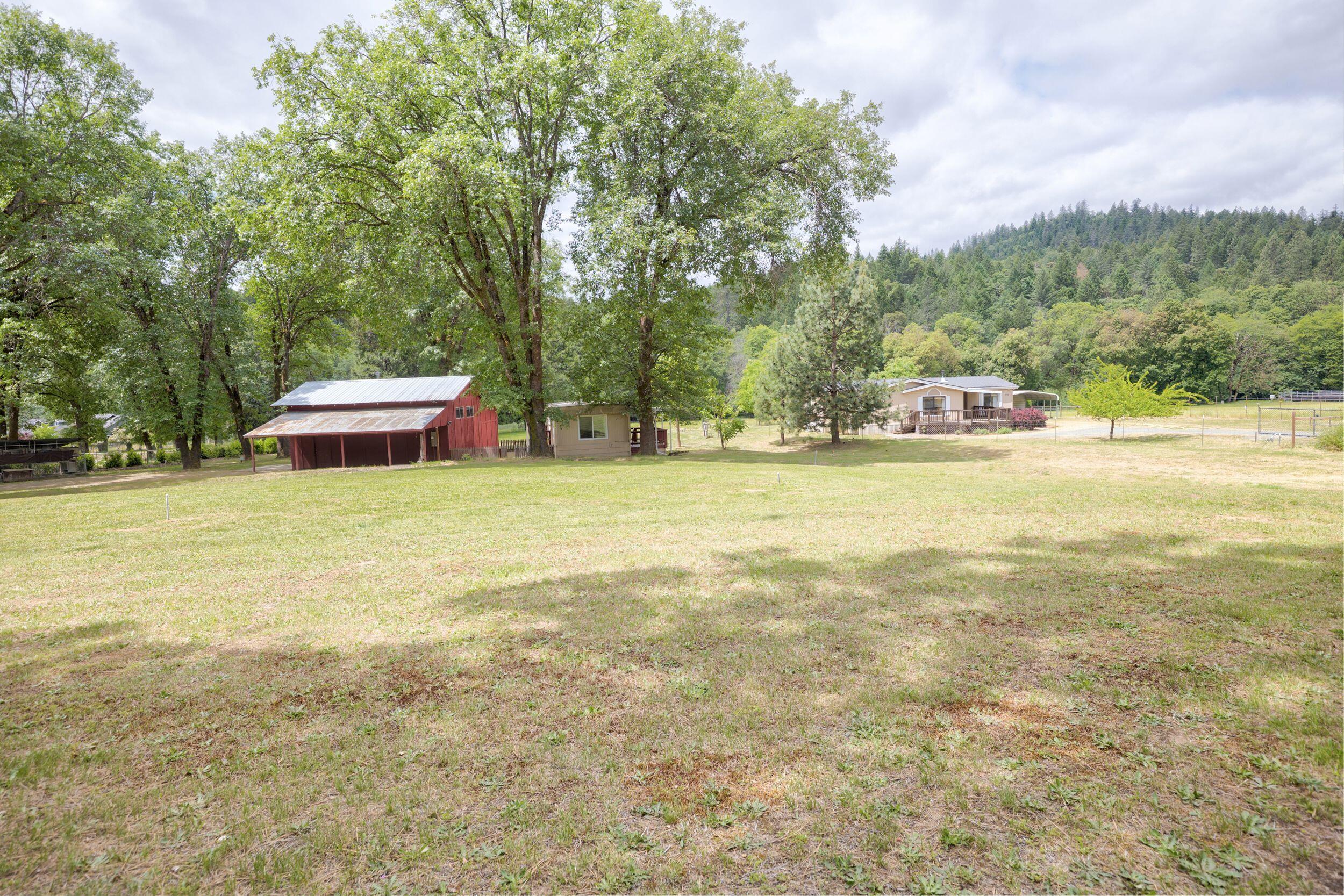 2720 Hugo Road Merlin, OR 97532 - Photo 23 of 38 view from entry of the barn/garage/shop & 2 bed 1 bath gate