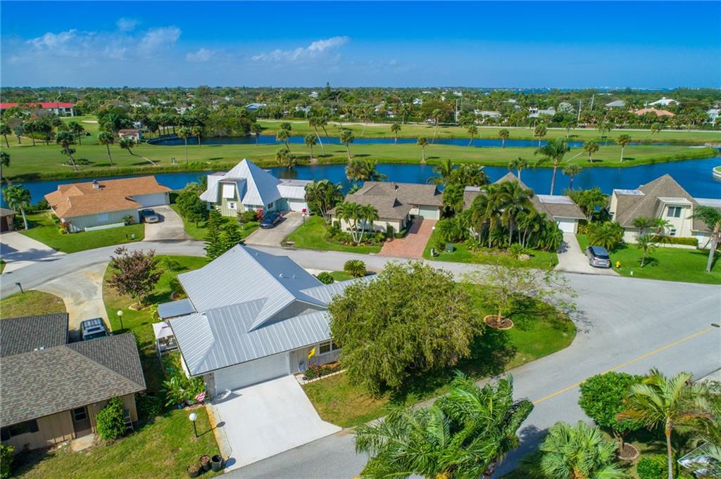 5712 Southeast Miles Grant Road Stuart, FL 34997 - Photo 3 of 28 an aerial view of a houses with outdoor space and street view