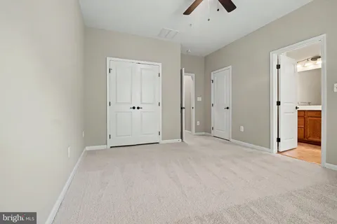 a view of an empty room with a bathroom