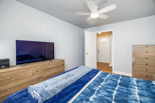 a bedroom with a bed and a dresser