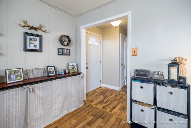 a kitchen with stainless steel appliances granite countertop a stove and a wooden floor