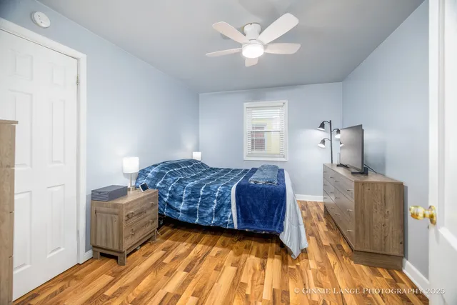 a living room with a couch and chandelier