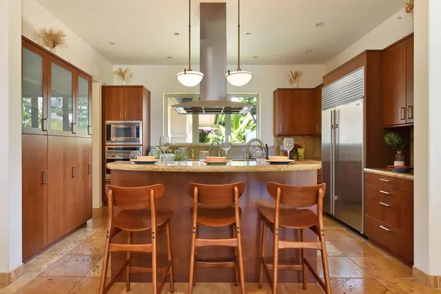 a kitchen with a sink cabinets and window
