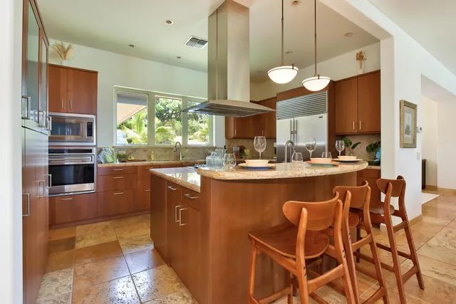 a living room with lots of furniture and a chandelier