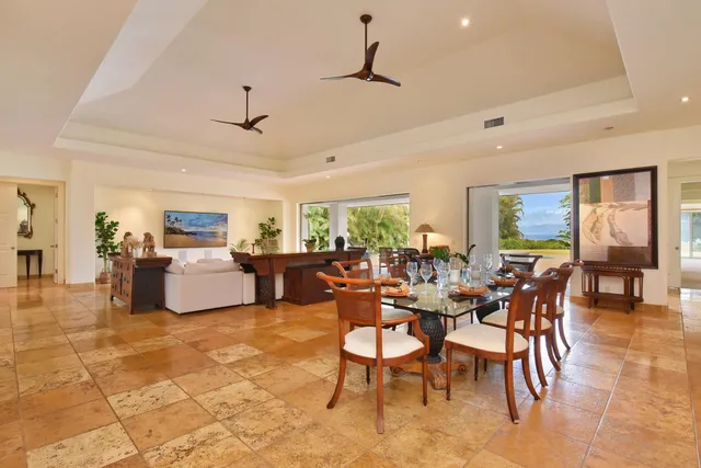 a bedroom with furniture and large window