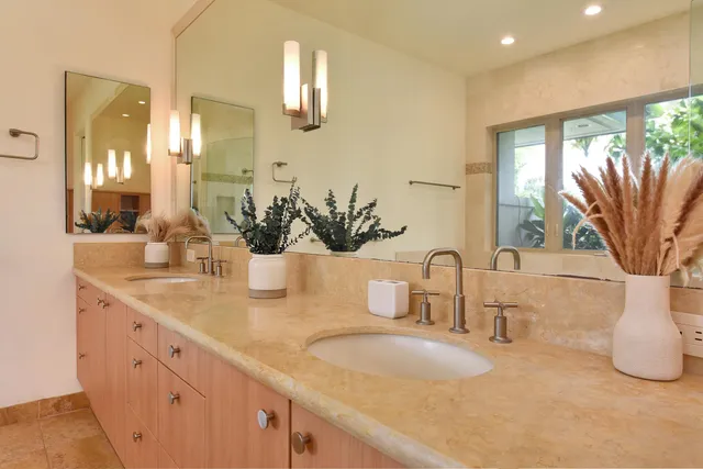 a large bathroom with a large tub and sink