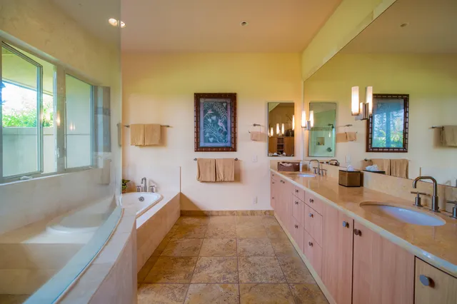 a bedroom with a large bed and a large window