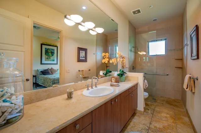 a bedroom with a bed and flat screen tv