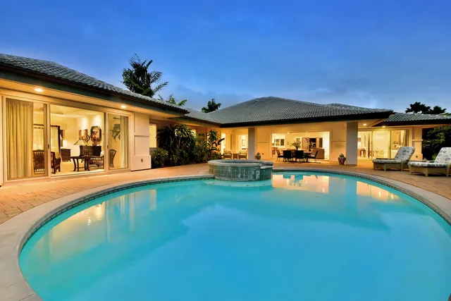 a view of a swimming pool with an outdoor seating