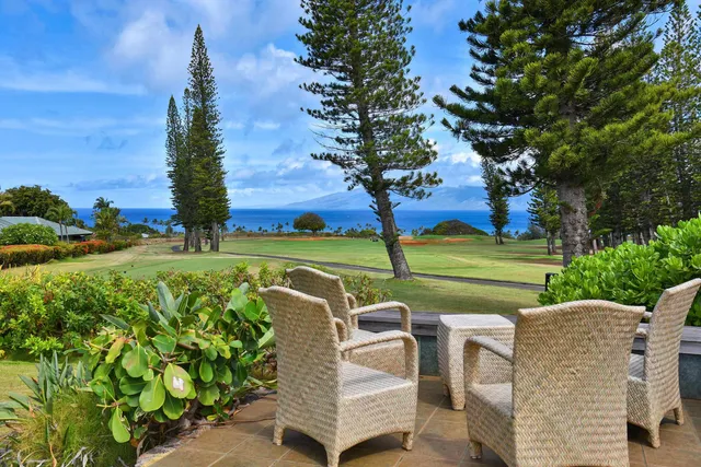 a view of a table and chairs in the garden
