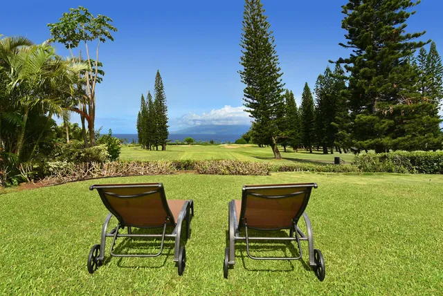 a view of a swimming pool with an outdoor space and seating area