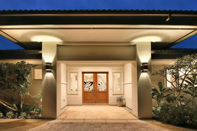 a front view of a house with garden