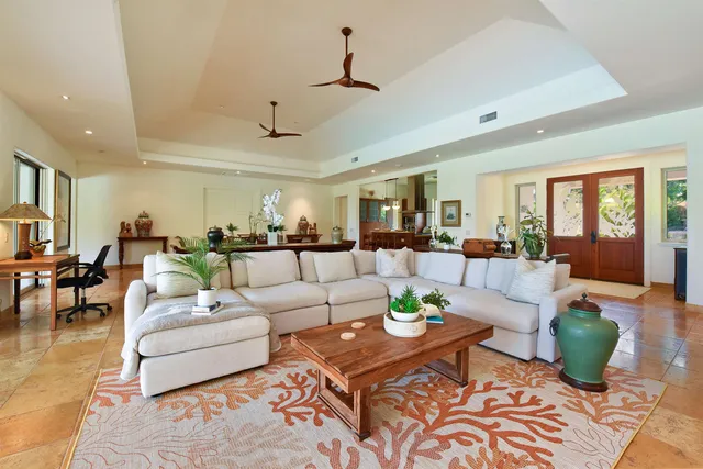 a living room with furniture kitchen view and a dining table