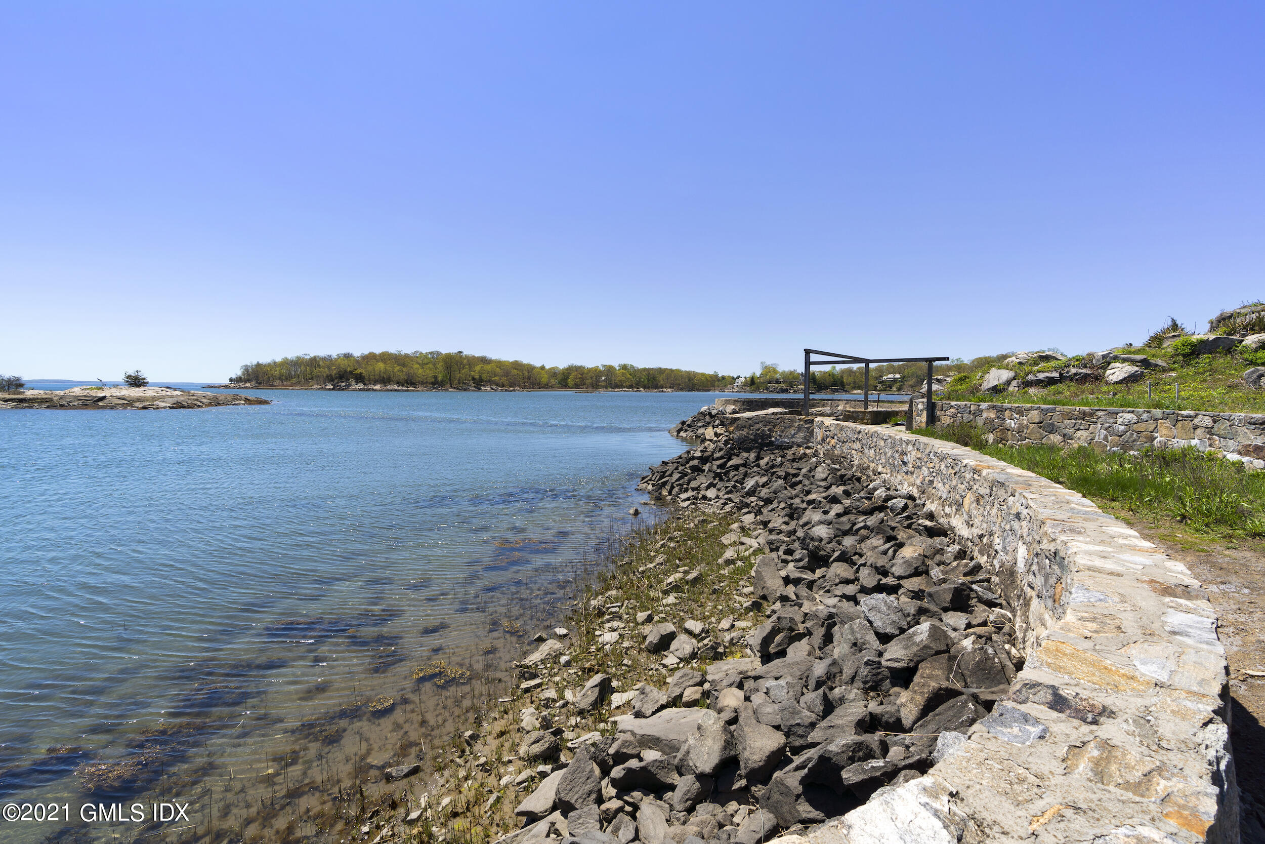 122 Delafield Island Road Darien, CT 06820 - Photo 17 of 34 a view of a lake with a city