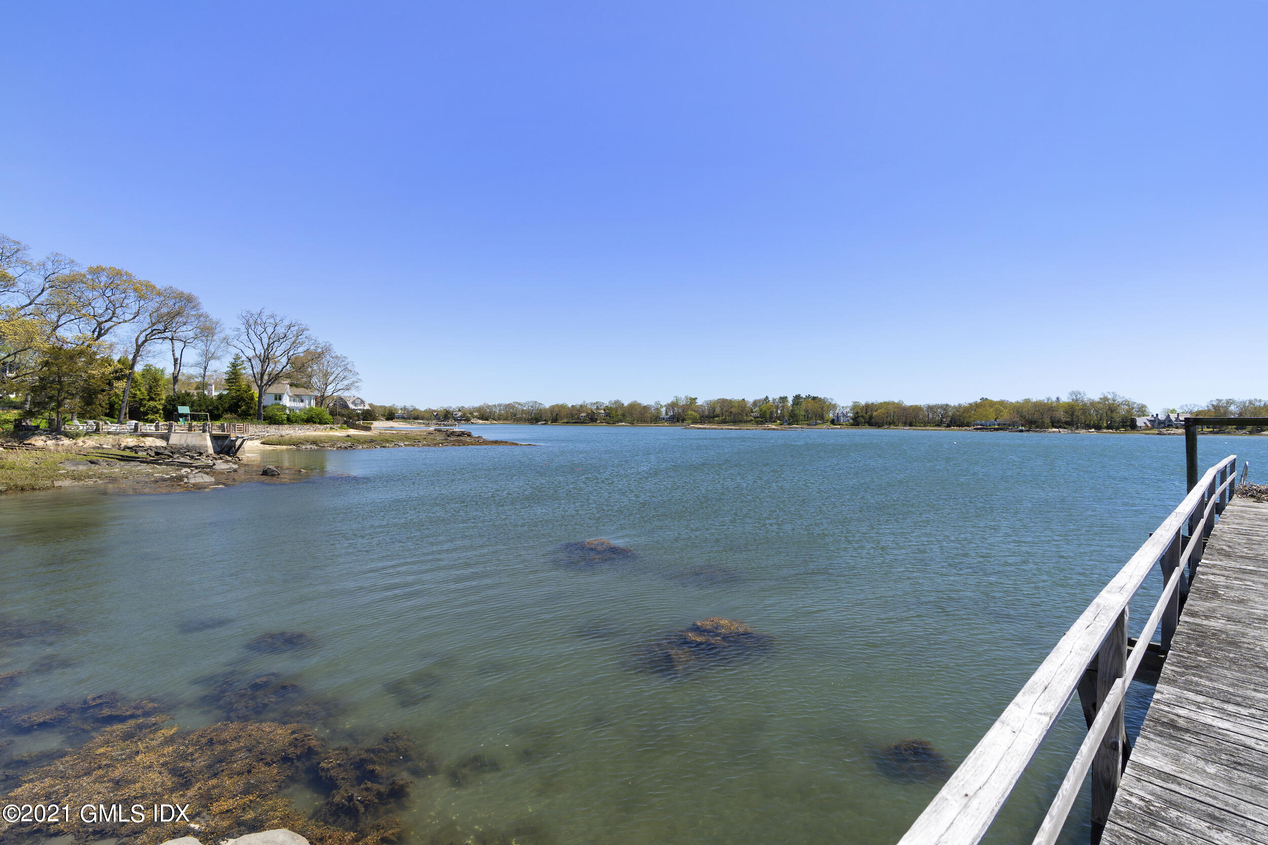 122 Delafield Island Road Darien, CT 06820 - Photo 18 of 34 a view of a lake with couches in the background